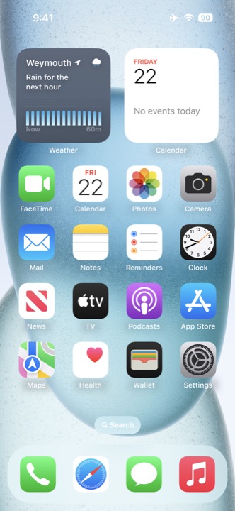 Home Screen on iPhone 15 running iOS 18